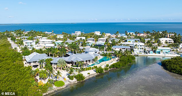 The palatial home of Summerland Key has six bedrooms, a kitchen with a custom walnut bar, cream marble flooring and a wine room with space for 520 bottles