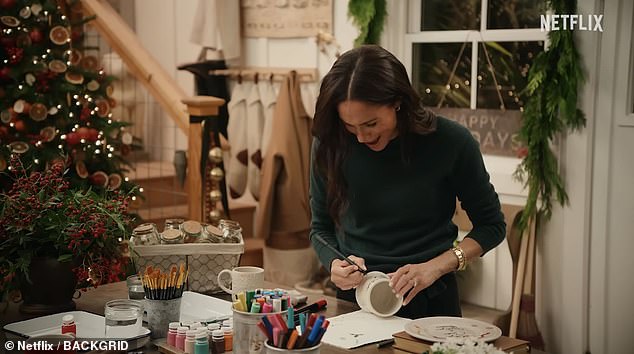 It was forest green cashmere to paint pottery as Meghan dressed in an Altuzarra tie-waist £317 cashmere sweater.