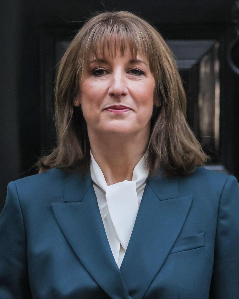 London, UK. 26th Nov, 2025. Rachel Reeves, Chancellor of the Exchequer of the United Kingdom, presents the red 'budget box', her ministerial despatch box, to waiting press outside 11 Downing Street. Her Treasury team step out with her. She then depar