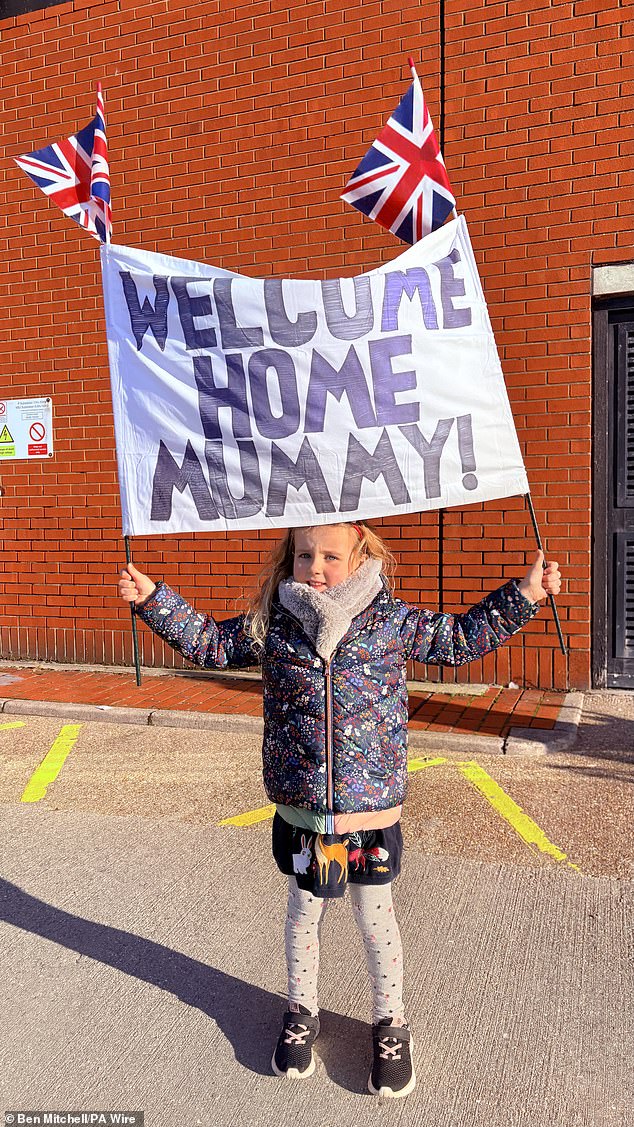 Ophelia, five, waits to welcome home her mother Lieutenant Commander Phoebe Hall as HMS Prince of Wales returns to Portsmouth Naval Base at the end of her eight-month deployment