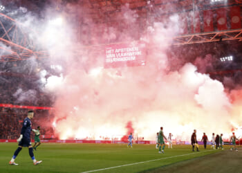Ajax clash abandoned as huge fireworks display erupts in stands and referee unable to guarantee player safety