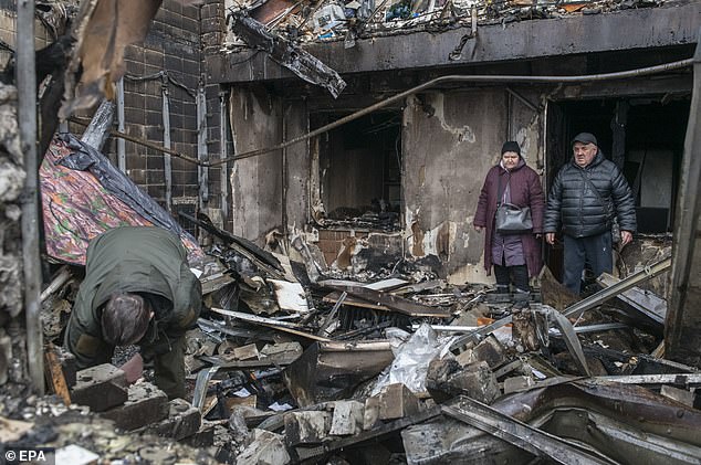 People survey the destruction after a Russian strike on a nine-storey residential building in the city of Vyshhorod in the Kyiv region, Ukraine, 30 November