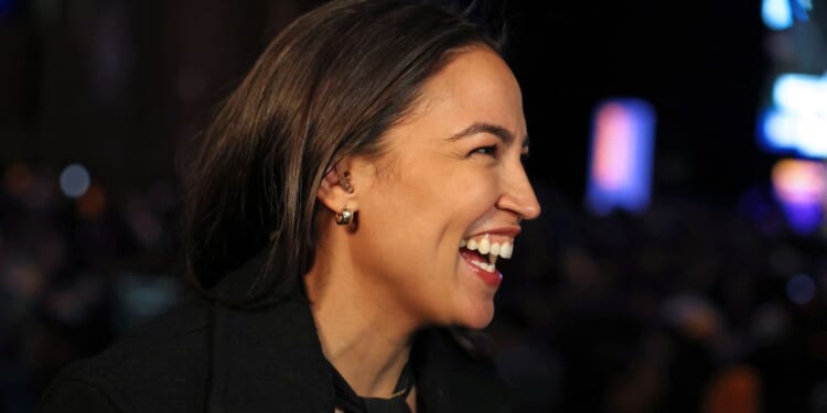 Rep. Alexandria Ocasio-Cortez celebrates New York City Mayoral candidate Zohran Mamdani's victory during an election night event in Brooklyn on Tuesday.
