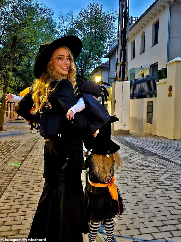 Amber Heard brought her five-month-old twins Ocean and Agnes out in public for the first time as she celebrated Halloween with daughter Oonagh Paige, four, in Madrid, Spain on Friday
