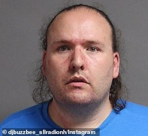 Laughton is pictured in a booking photo