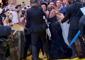 Ariana Grande was ambushed by an overzealous fan while walking the red carpet at the Singapore premiere of her new film Wicked: For Good on Thursday