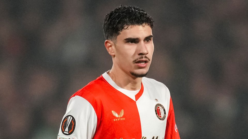 Feyenoord player in red and white jersey.