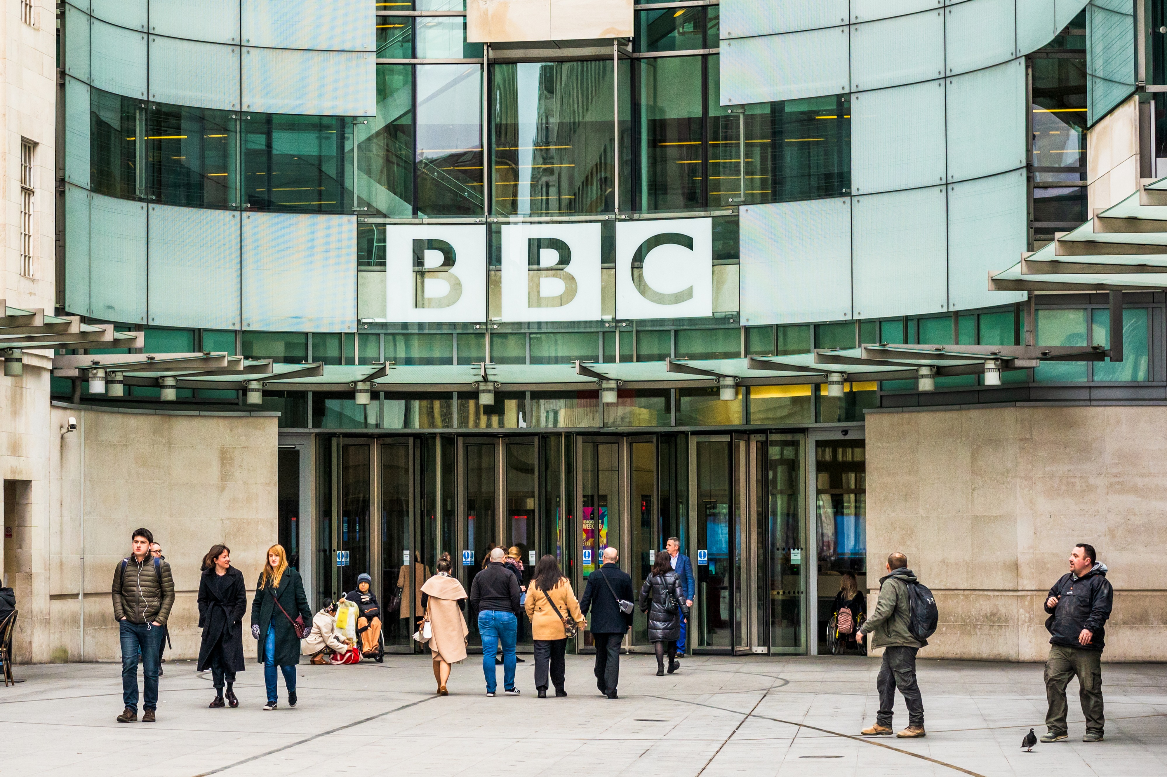People outside the main entrance to the BBC's Broadcasting House in central London.