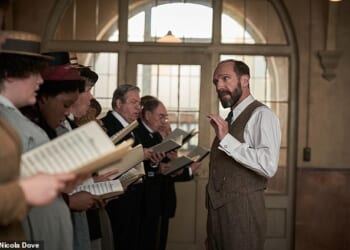 Roger Allam as Alderman Duxbury and Ralph Fiennes as Dr Guthrie, Amara Okereke as Mary, Alun Armstrong in The Choral