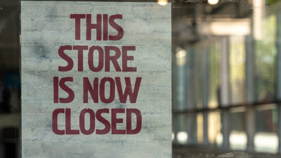 Store closure sign on shopfront window