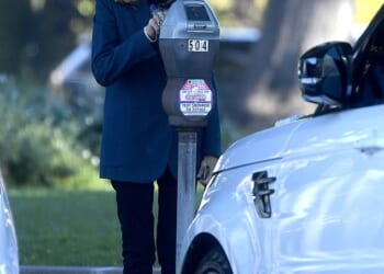 Lovely Barbara feeds the meter in Beverly Hills during a trip into town for a meeting