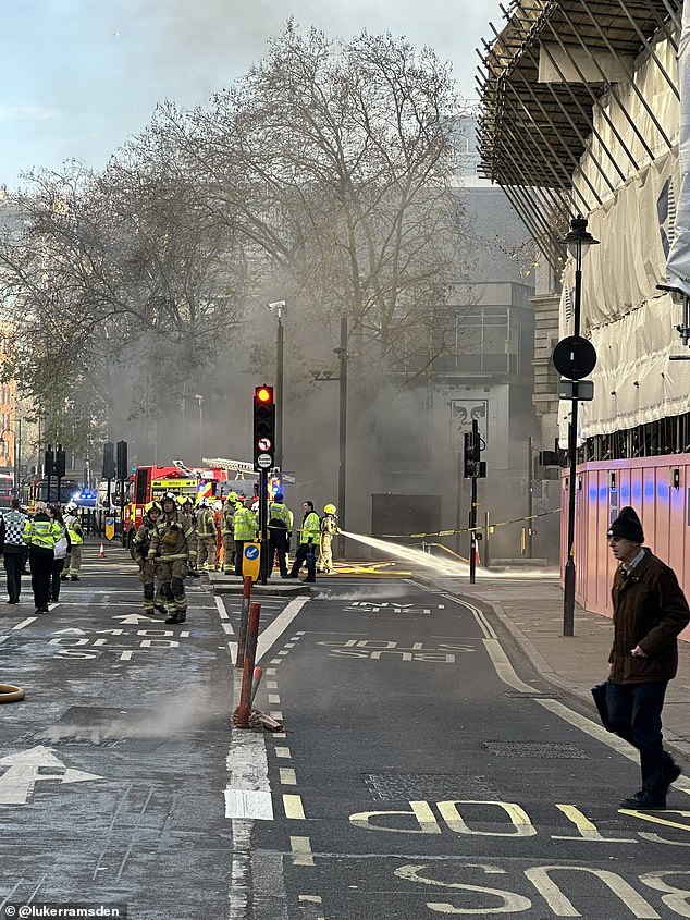 Black smoke is engulfing a central London district after fire erupted in an underground tunnel