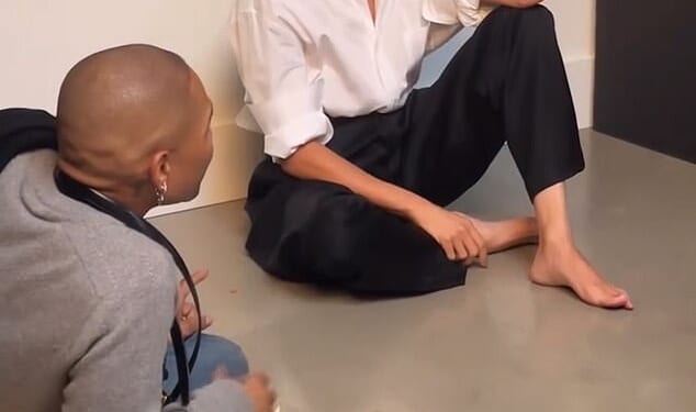 In the behind the scenes footage Meghan, 44, blushes and covers her face with her hand before a male staff member tells her she was '10 out of 10'