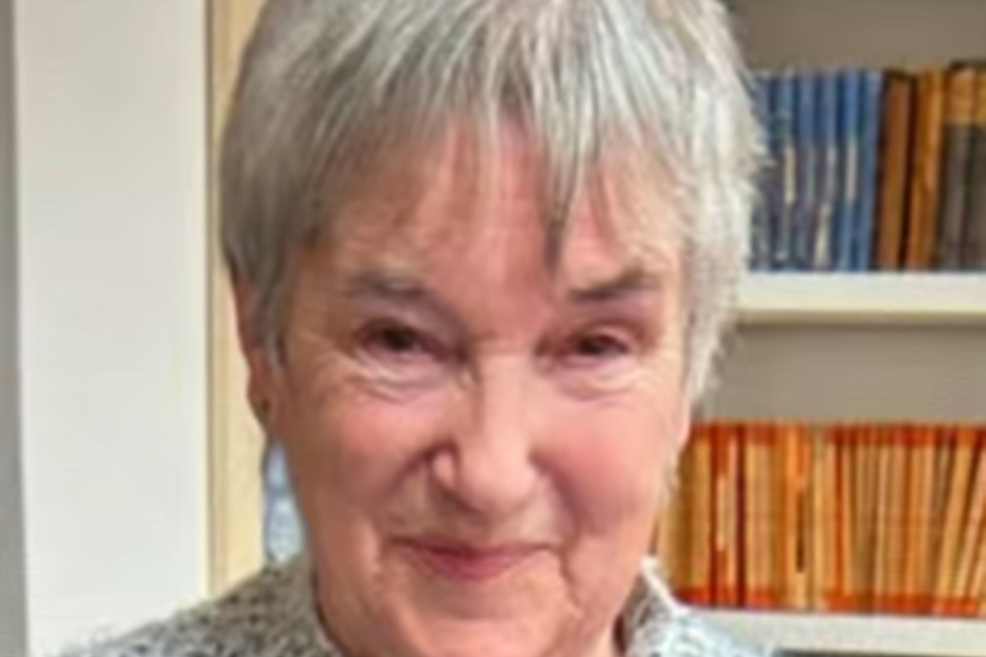 An image collage containing 1 images, Image 1 shows Elaine, a woman with short gray hair, wearing a gray knitted sweater