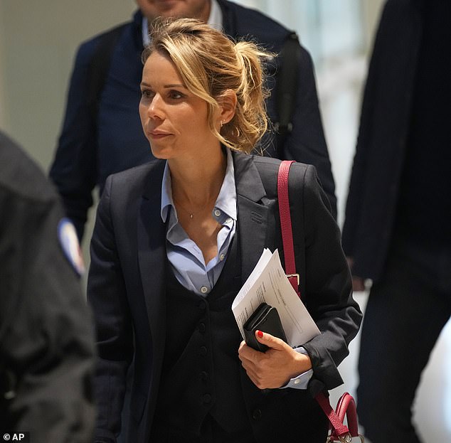 Tiphaine Auziere, daughter of Brigitte Macron, arrives at a courtroom as ten people go on trial accused of cyberbullying Brigitte Macron after they allegedly made "malicious" comments online spreading claims that President Emmanuel Macron's wife is a man, Tuesday, Oct. 28, 2025 in Paris