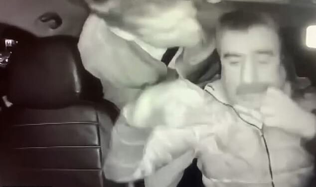 The British man was seen leaning through the seats and appeared to attack the driver