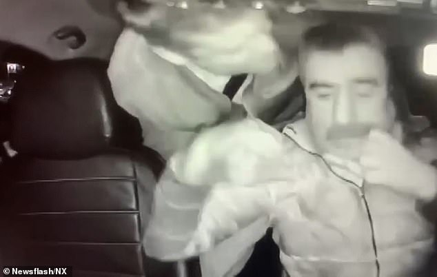 The British man was seen leaning through the seats and appeared to attack the driver