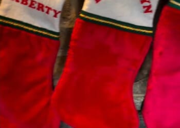 Brooklyn Beckham's gran has begged him to come home for Christmas with a pointed Instagram snap of his personalised stocking hanging on her fireplace on Friday