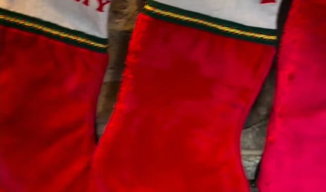 Brooklyn Beckham's gran has begged him to come home for Christmas with a pointed Instagram snap of his personalised stocking hanging on her fireplace on Friday