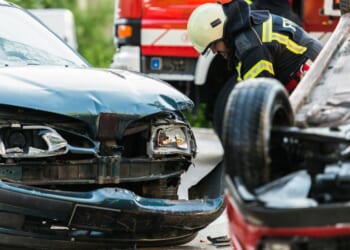 Firefighters at a car accident scene.