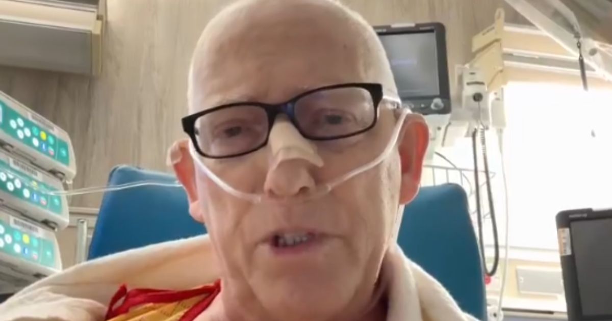 Scott Adams posted live streams to X and YouTube on Wednesday explaining he was confined to a hospital chair and therefore would not be recording an episode.