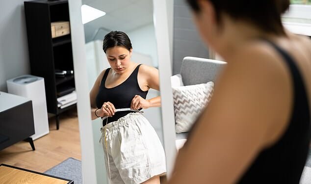 The first four weeks on weight loss injections can be challenging - here's what to expect (stock image posed by model)