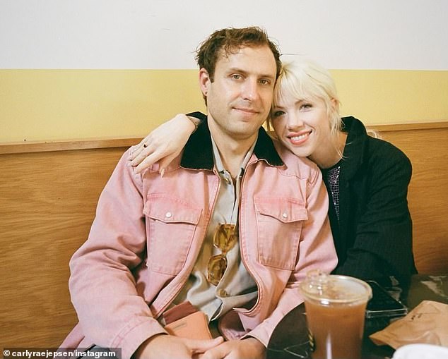 The Call Me Maybe icon , 39, who wed her husband, 40, last month, announced the happy news in a sweet photoshoot baring her bump, captioned: 'Hi baby.'