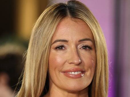 Cat Deeley smiling with long blonde hair.