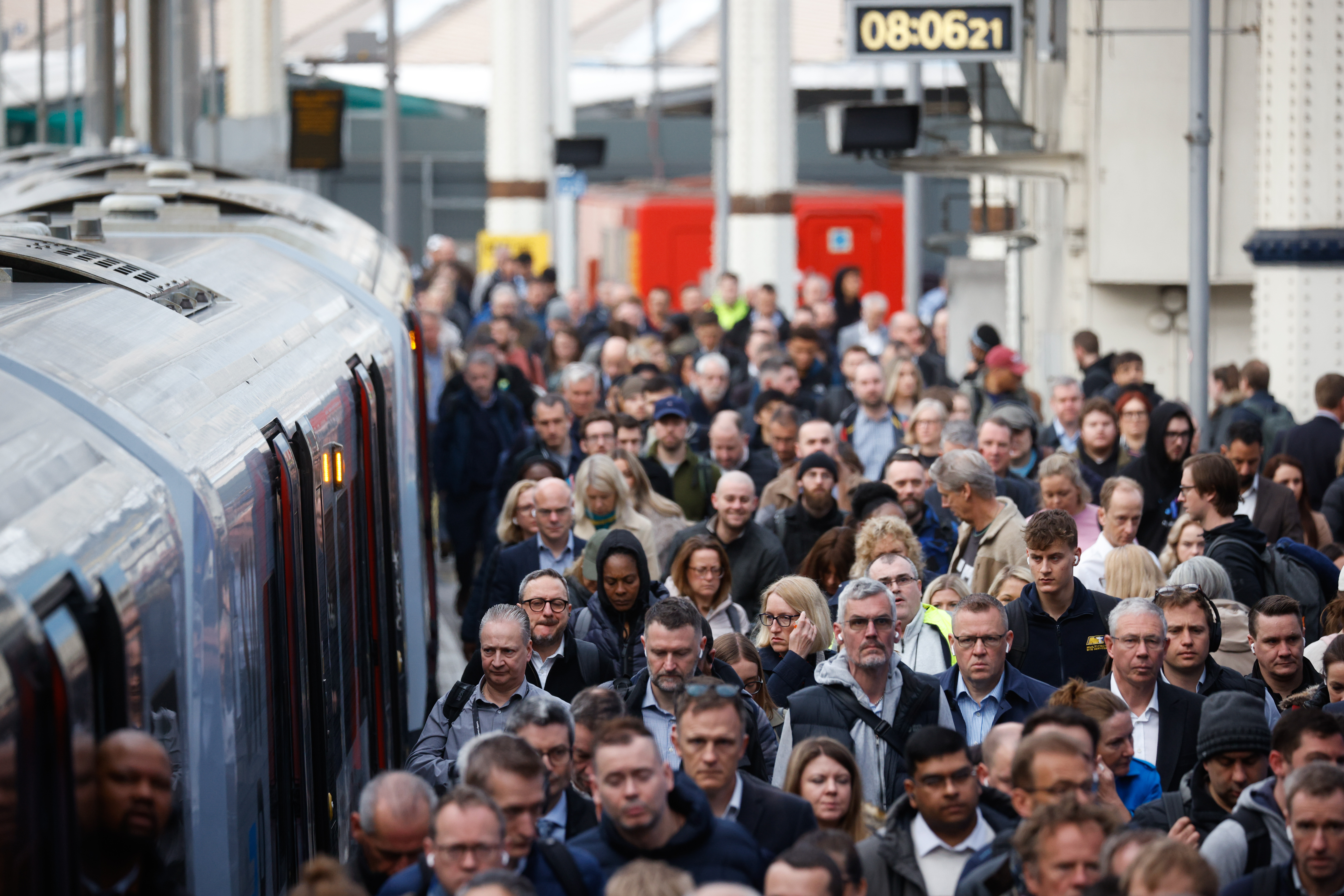 Passengers disembark a train at Waterloo railway station in London, UK, during a train drivers strike.