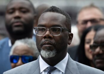 Chicago Mayor Brandon Johnson listens as Illinois Gov. J.B. Pritzker speaks at a news conference to address President Donald Trump's plan to send National Guard troops into the city on Aug. 25, 2025, in Chicago, Illinois.