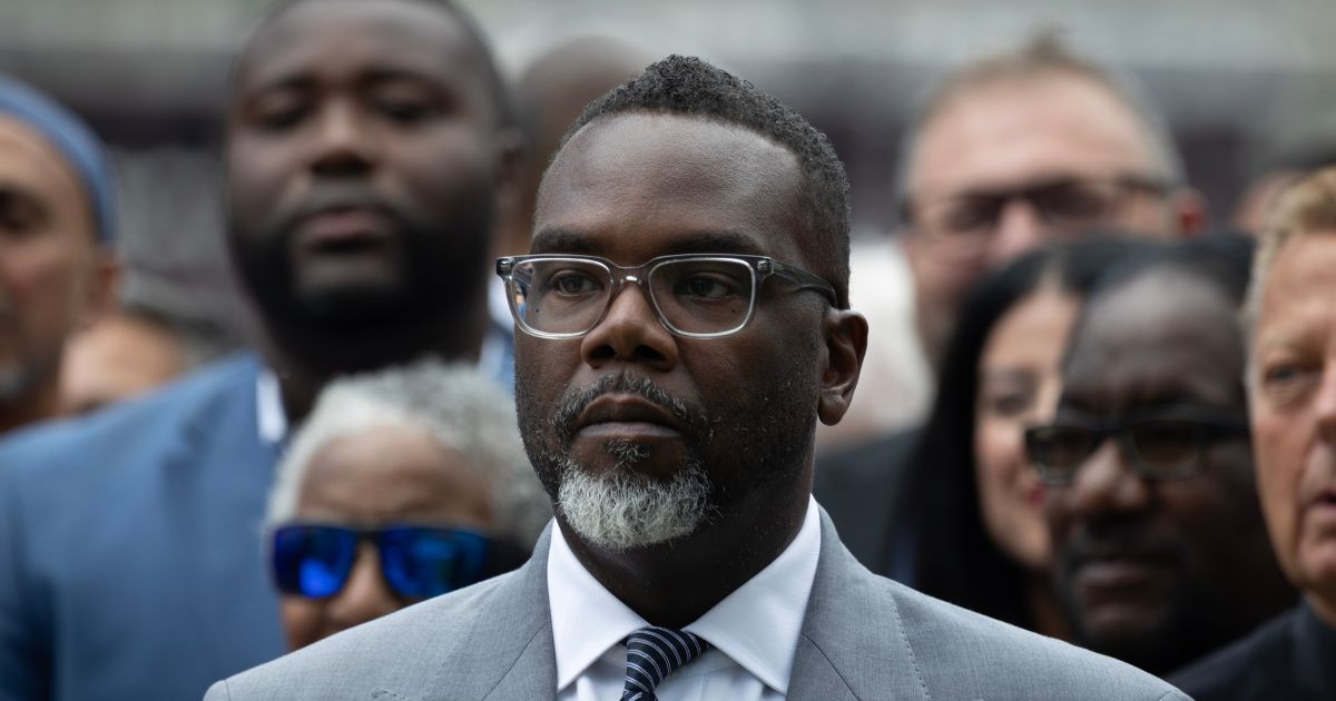 Chicago Mayor Brandon Johnson listens as Illinois Gov. J.B. Pritzker speaks at a news conference to address President Donald Trump's plan to send National Guard troops into the city on Aug. 25, 2025, in Chicago, Illinois.