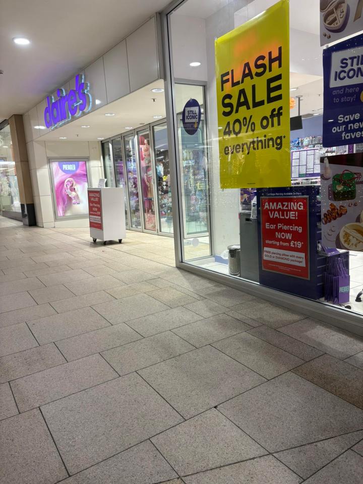 A Claire's store with a "Flash Sale 40% off everything" sign and an "Ear Piercing Now starting from £19" sign.