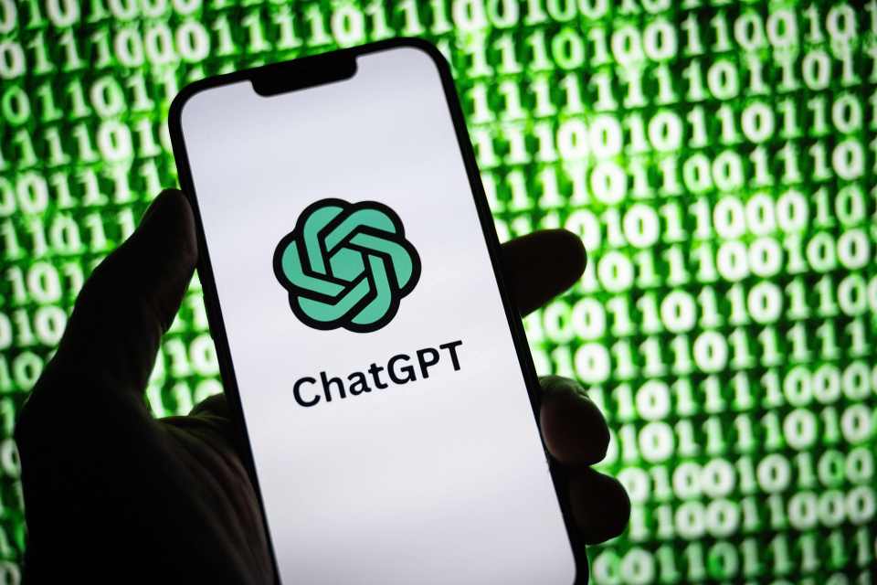 A smartphone displays the ChatGPT logo and name, with a background of green binary code.