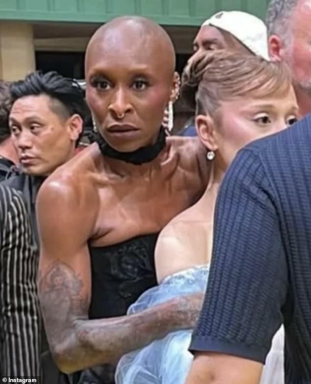 Cynthia Erivo 's lightning quick reactions have earned her a flood of memes after she rescued close friend and co-star Ariana Grande from an over excited fan on Thursday