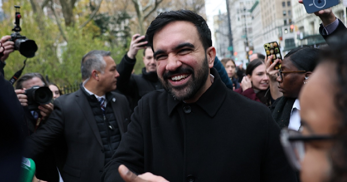 New York City Mayor-elect Zohran Mamdani gladhands supporters after a Thursday news conference in New York.