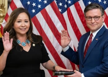 Rep. Adelita Grijalva, a Democrat from Arizona, re-enacts her swearing-in by Speaker of the House Mike Johnson, a Republican from Louisiana, at the U.S. Capitol in Washington, D.C., on Nov. 12, 2025.