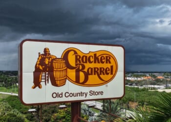 A Cracker Barrel sign featuring the restaurant chain's iconic logo stands outside a restaurant in Florida City, Florida on Aug. 27, 2025.