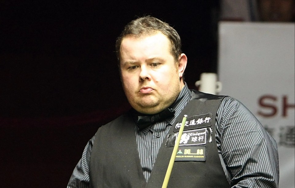 Stephen Lee of England reacts during his snooker match.