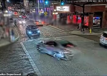 Terrified pedestrians can be seen running for safety as the silver Toyota barrels through an intersection and hitting more than a dozen people on the patio of the bar