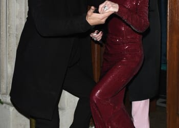 Sharon Osbourne was escorted of a high-end London restaurant by a very familiar face as she made her first public appearance since Ozzy's death on Wednesday