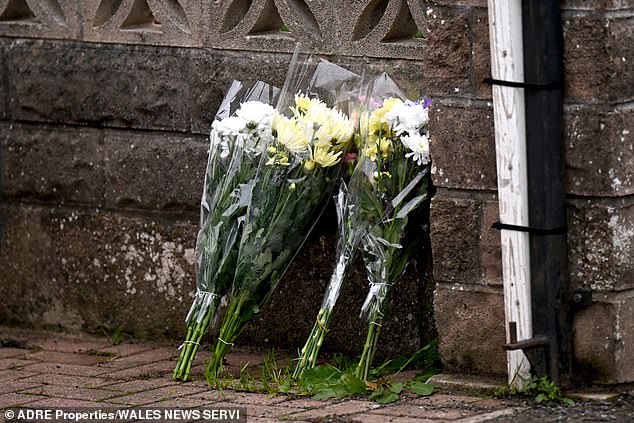 Floral tributes at the house where the child was killed. The baby was on the family visit with his father to the house in Rogiet, Gwent
