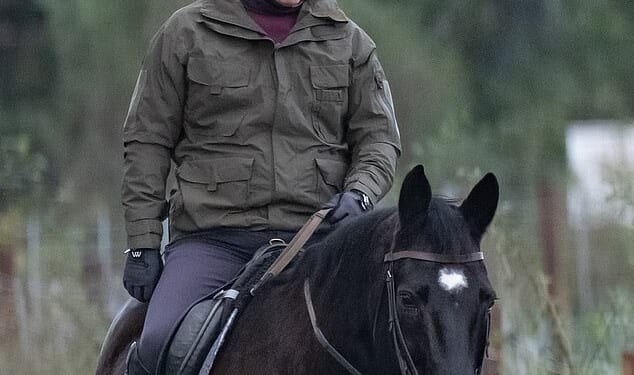 The disgraced 65-year-old, who was accompanied by a female companion, looked downcast as they took the horses out for a ride.