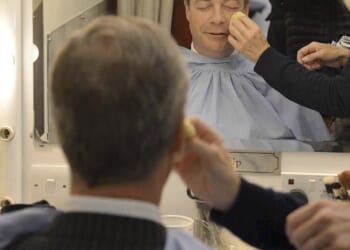 Historian and best-selling author Lisa Hilton, who has presented BBC TV documentaries, has made the extraordinary claim that Farage's face was painted with deliberately contaminated brushes when appearing on its programmes. Pictured: Farage sits wearing make-up before appearing in the 'BBC Vote 2013' studio at Milbank in London
