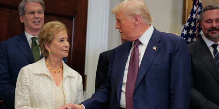President Donald Trump speaks with Secretary of Education Linda McMahon during an executive order signing ceremony in the Roosevelt Room of the White House on July 31, 2025, in Washington, D.C.