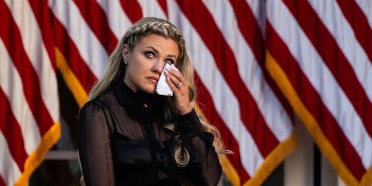 Erika Kirk receives the Presidential Medal of Freedom awarded to late conservative activist Charlie Kirk during a ceremony in the Rose Garden of the White House on Oct. 14, 2025.