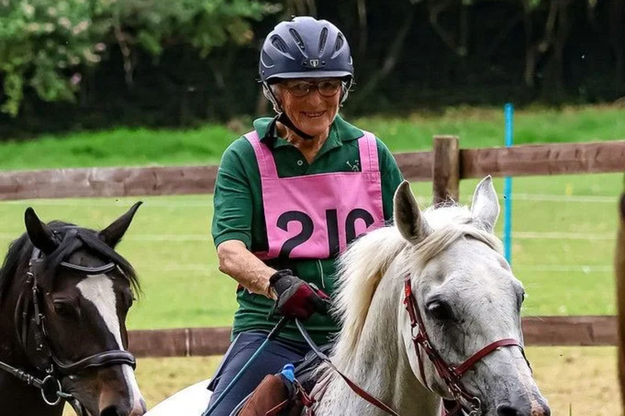 An image collage containing 1 images, Image 1 shows Geraldine White riding her horse Emeer through a water obstacle during an endurance event
