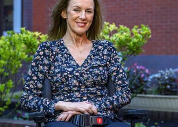 A smiling Trudi Burgess, 57, pictured at Southport Hospital's Spinal Care Centre in Lancashire