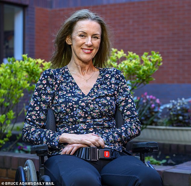 A smiling Trudi Burgess, 57, pictured at Southport Hospital's Spinal Care Centre in Lancashire