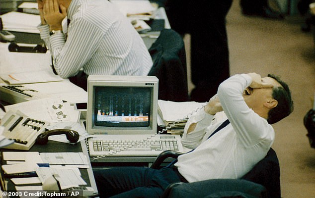 A huge sell-off on the US stock market led to global market turmoil when automated stock trading computer programs created a selling frenzy in October 1987. Pictured: The reaction on the floor of the London Stock Exchange
