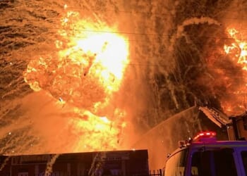 Projectiles burst out of the blaze like a firework display